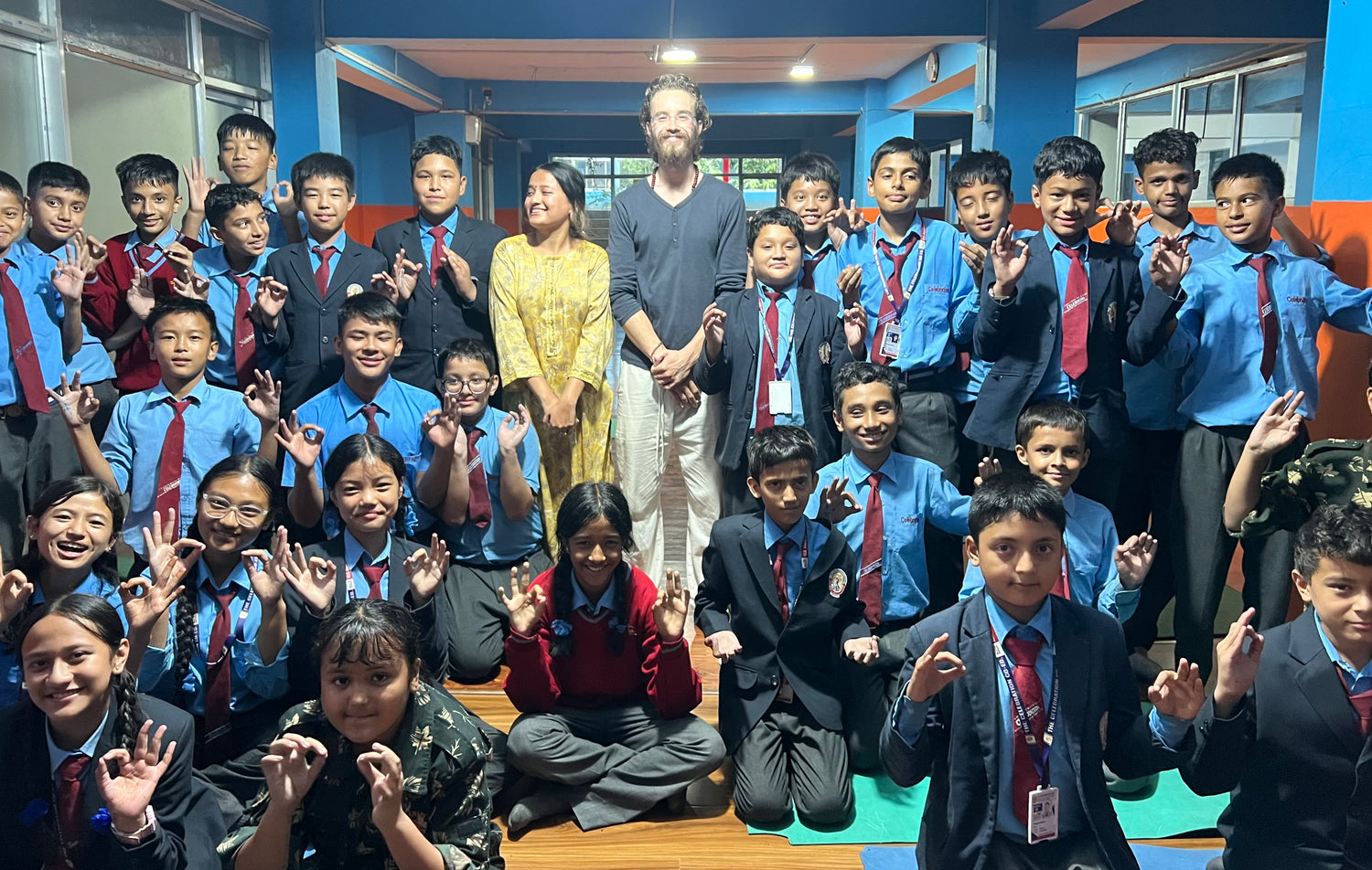 Group of students in school uniforms with certified meditation teachers in a classroom meditation session. 
Online guided meditation session – Inner Sky Studio